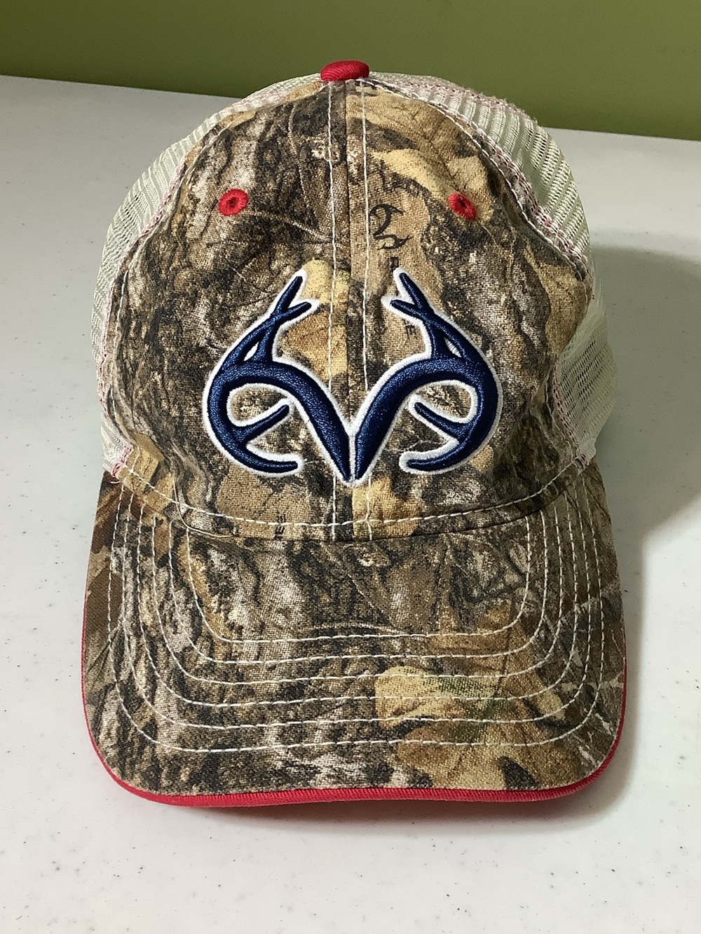 Realtree camo and red trim trucker hat